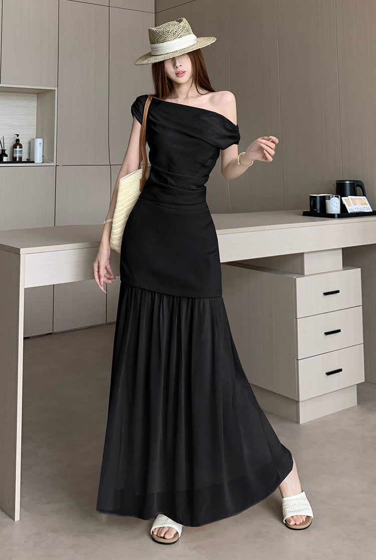 Elegant and sophisticated two-piece suit set, featuring a fitted Top a delicate off-the-shoulder design