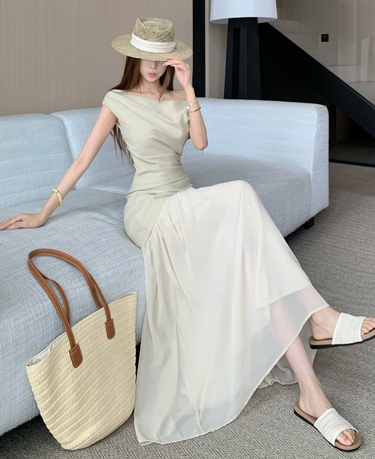 Elegant and sophisticated two-piece suit set, featuring a fitted Top a delicate off-the-shoulder design
