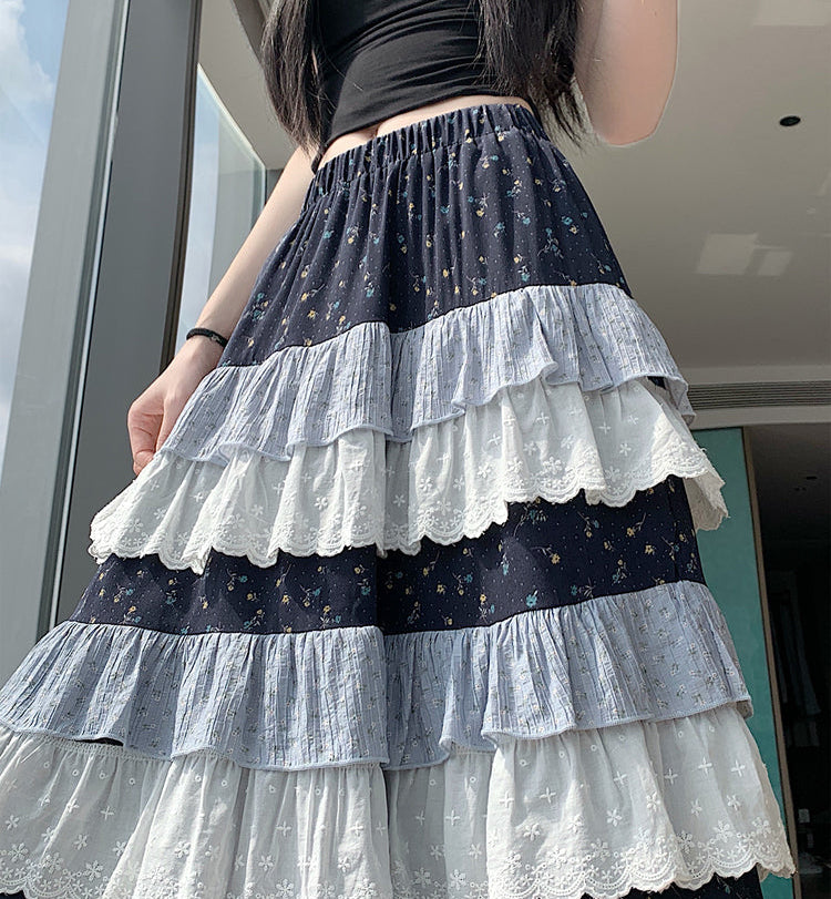 Person wearing a layered skirt with star patterns indoors