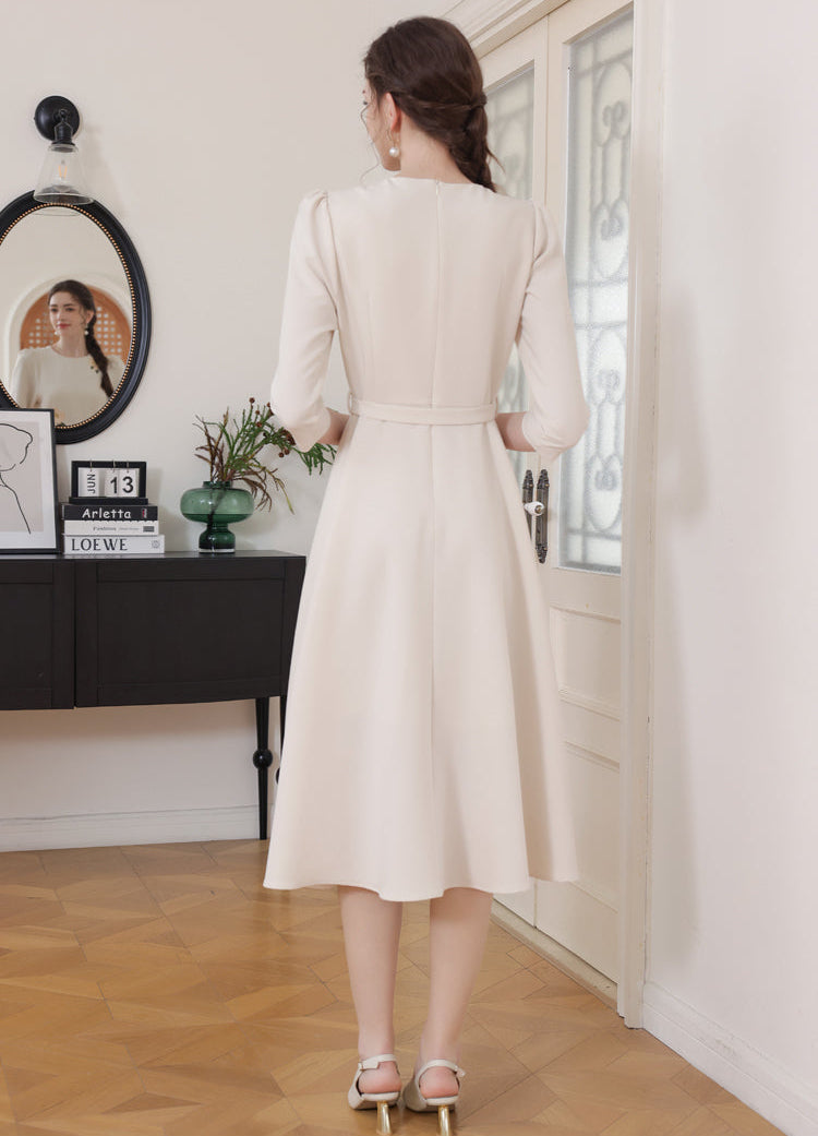 Vintage-Style Cream Belted Dress with Floral Accents